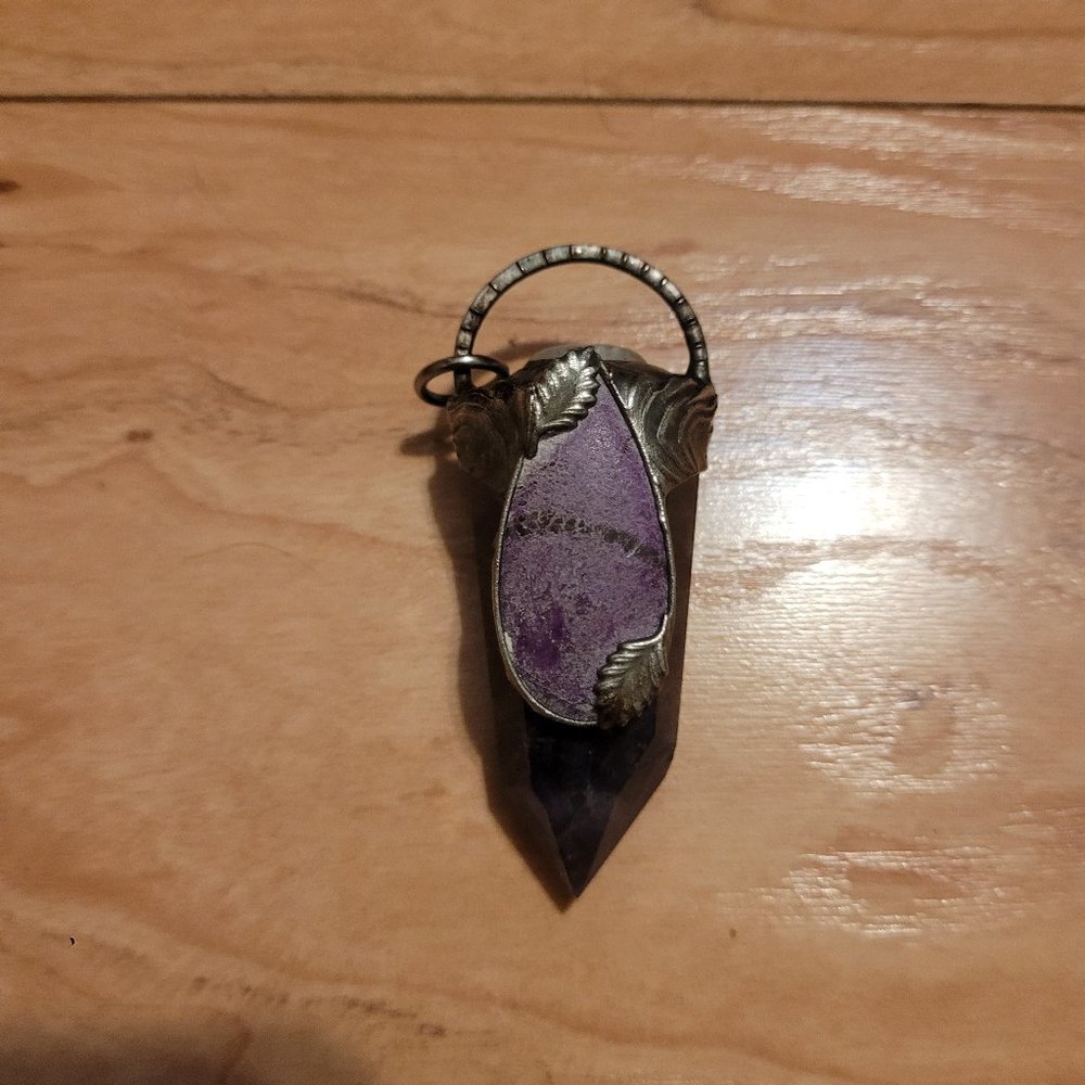 Large polished chevron amethyst pendant set with purpurite and moonstone.